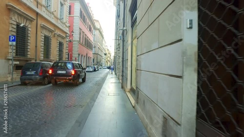 Walk POV at famoust Rome shopping street Via Condotti at the bottom of the Spanish Steps photo