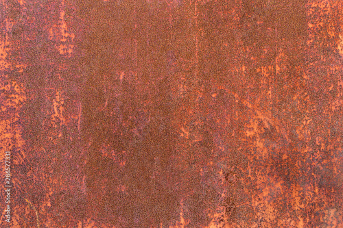 Close-up detail old iron sheet texture for background. Weathered metal with orange rust.