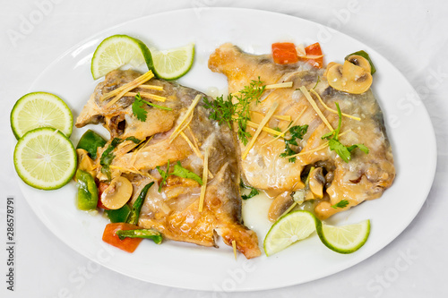 Pomfret fish pieces on plate, spicy Indian dish. Popular amongst Bengalis and south Asia for it's taste.