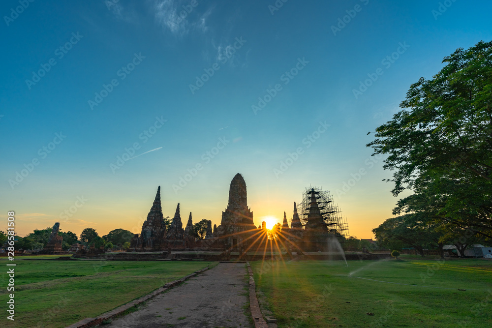sunrise behind the ruins pagoda of wat Ckaiwatthanaram Temple of Ayutthaya Province .( Ayutthaya Historical Park )Thailand..