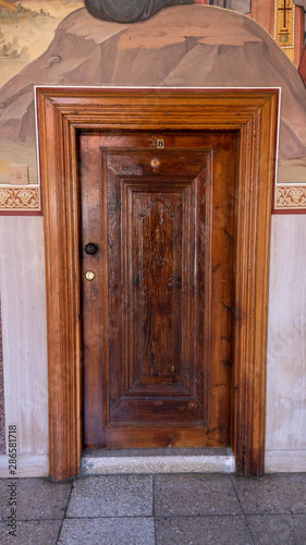 Wooden Antique Door Monastery with Fresco Backround