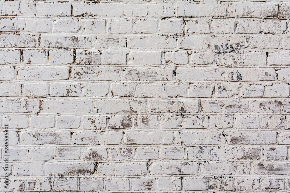 Fototapeta premium Empty Old Brick Wall Texture. Painted Distressed Wall Surface. Grungy Wide Brickwall. Shabby Building Facade With Damaged Plaster.