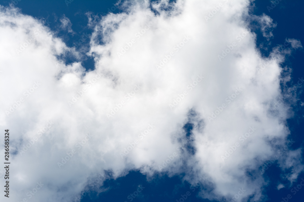 White, Fluffy Clouds In Blue Sky. Abstract Background From Clouds. White, Fluffy Clouds In Blue Sky. Abstract Background From Clouds.