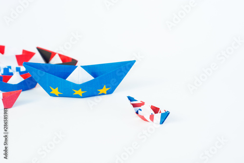 paper ships from the flags of the European Union and the UK and other countries of europe on white background, concept of an agreement on Brexit