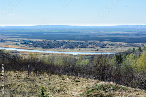 Beautiful view of the fields  meadows  the village and the river Sviyaga. Panorama of the famous Sviyaga river from a high mountain. Ulyanovsk region  Russia.