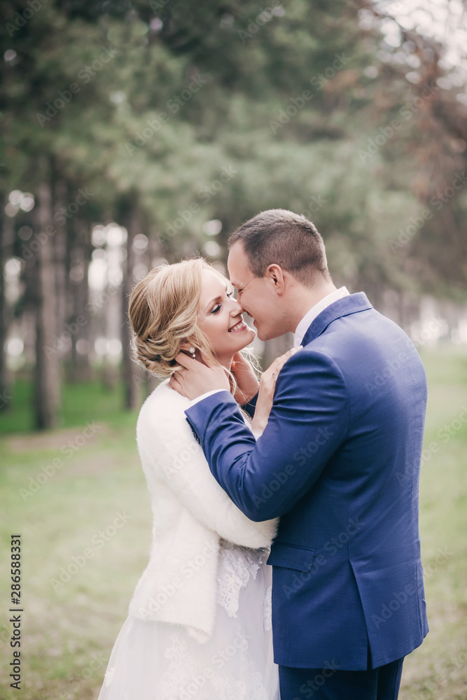 Happy bride and groom on their wedding in garden Happy bride and groom on their wedding in garden