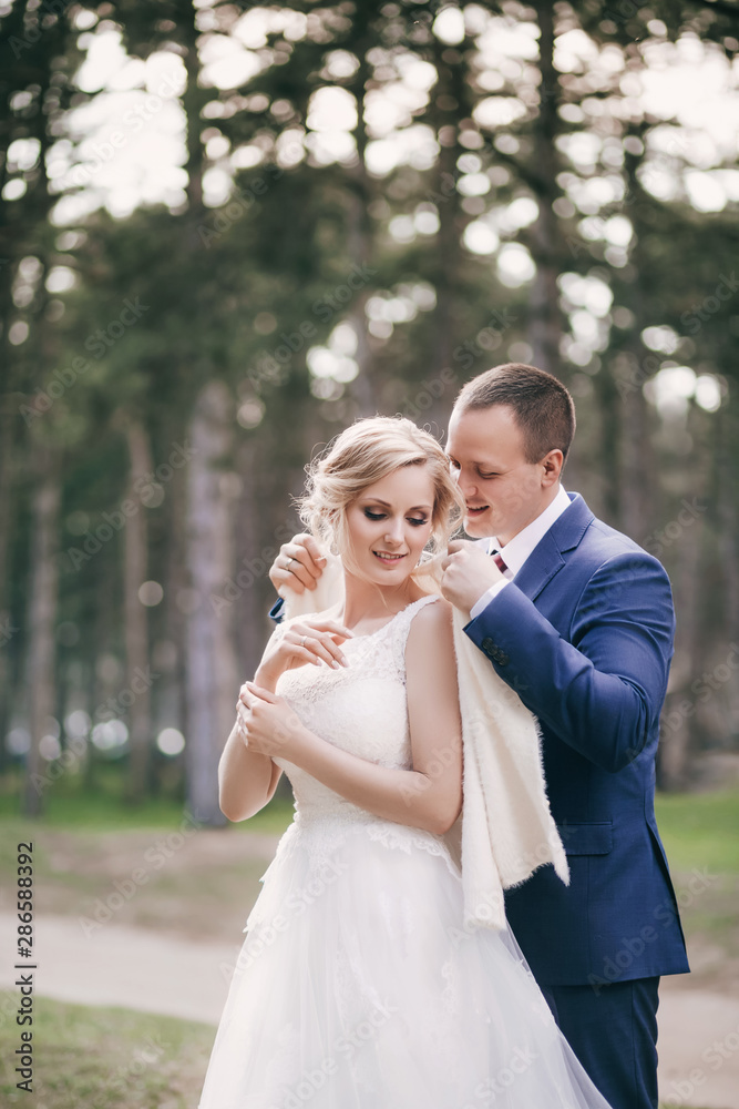 Happy bride and groom on their wedding in garden Happy bride and groom on their wedding in garden