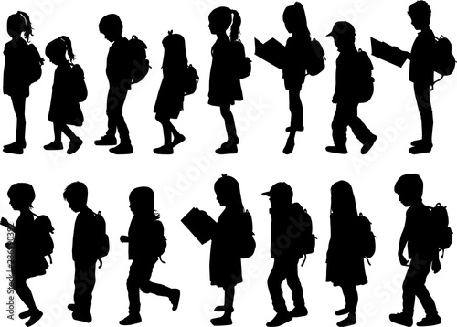 Silhouette of a child with a backpack .