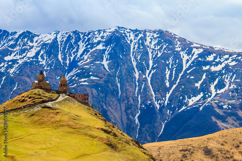 Gergeti Trinity Church (Tsminda Sameba), Holy Trinity Church near the village of Gergeti in Caucasian mountains, Georgia photo