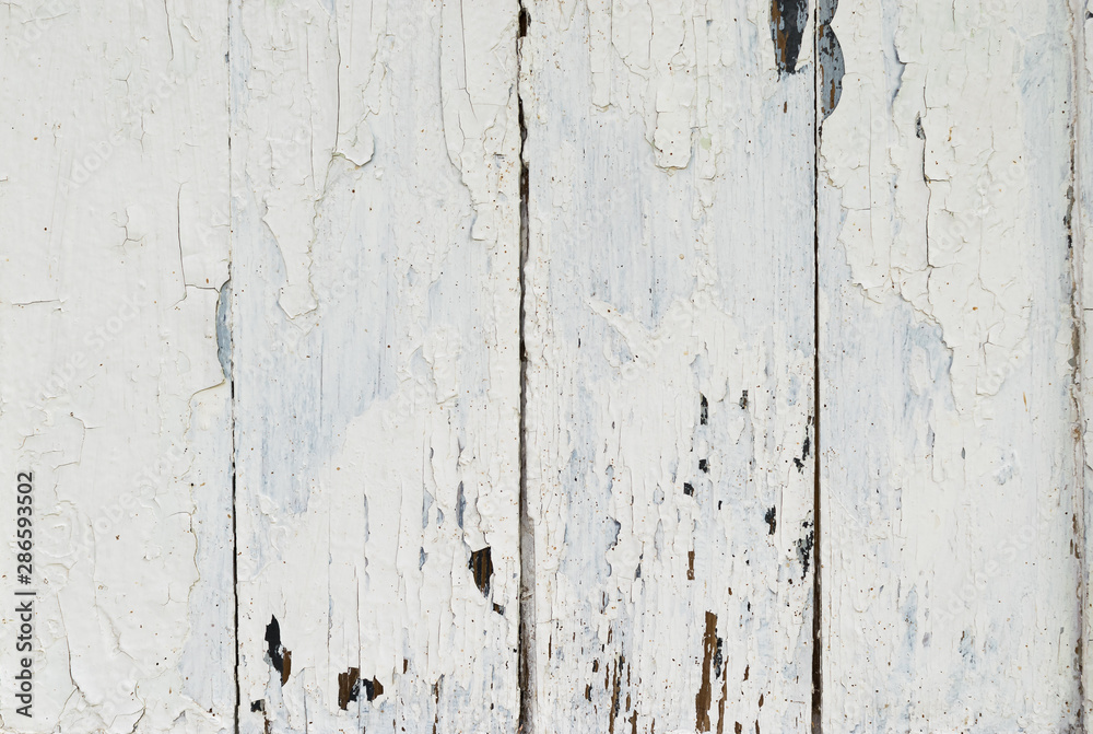 White panels from wooden boards aged from time to time as a background White panels from wooden boards aged from time to time as a background