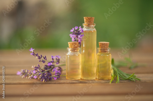 lavender essential oil in  beautiful bottle on table