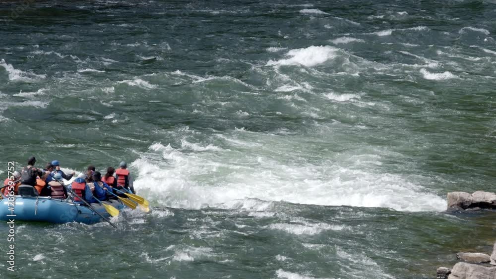 People white water rafting as they hit a rapid on the Snake River in Jackson Canyon, Wyoming. People white water rafting as they hit a rapid on the Snake River in Jackson Canyon, Wyoming.