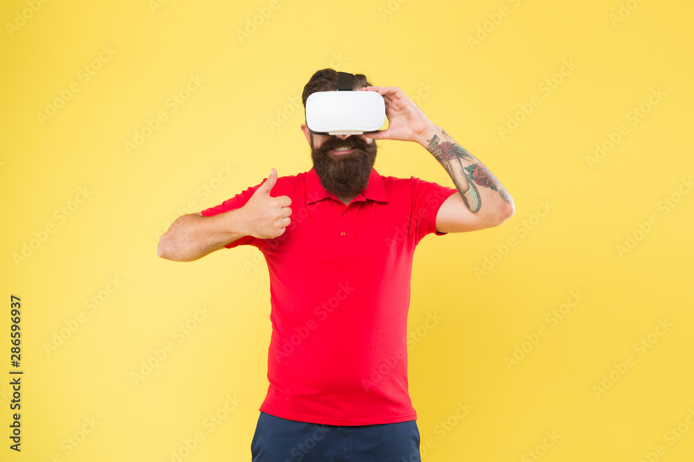 Naklejka premium Virtual reality is like dreaming with your eyes open. Impressive experience. Man play game in VR glasses. Hipster with virtual reality headset. Virtual communication concept. Virtual simulation