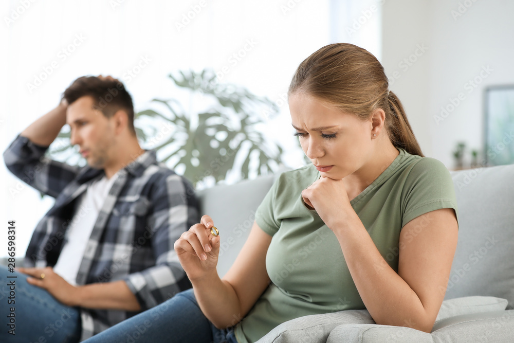 Quarreled young couple at home. Concept of divorce Quarreled young couple at home. Concept of divorce