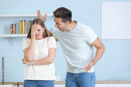 Quarreling couple at home. ...