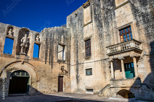 The courtyard of the castle  or ducal palace  of the Castromediano Lymburgh  in Cavallino  Lecce  Puglia  Salento  Italy. Empty windows and niches with stone statues.