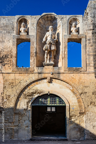 The courtyard of the castle, or ducal palace, of the Castromediano Lymburgh, in Cavallino, Lecce, Puglia, Salento, Italy. Empty windows and niches with stone statues. photo