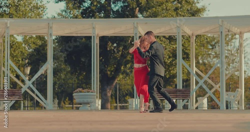 Wallpaper Mural Dancing in the city parks. Dance steps, man and woman dance passionate tango. Torontodigital.ca