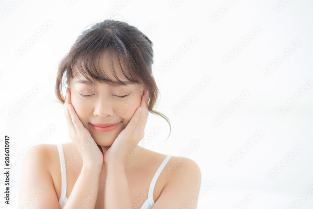 Portrait of beautiful young asian woman smile while wake up healthy and wellness with sunrise at morning in the bedroom, asia girl skin care with happy with fresh, lifestyle and relax concept. Portrait of beautiful young asian woman smile while wake up healthy and wellness with sunrise at morning in the bedroom, asia girl skin care with happy with fresh, lifestyle and relax concept.