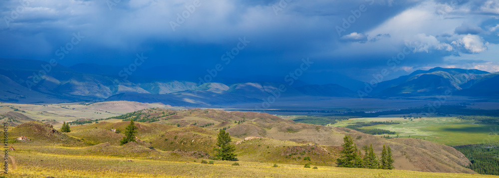 Mountain landscape, stormy sky above the peaks