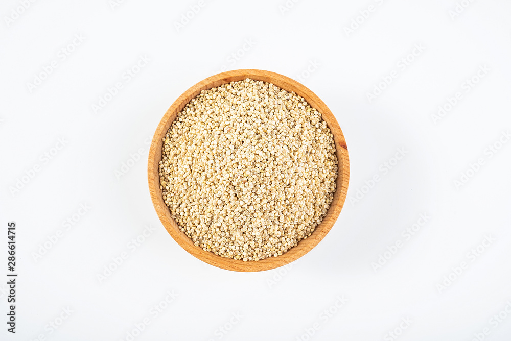 A wooden bowl of miscellaneous grains buckwheat on a white background A wooden bowl of miscellaneous grains buckwheat on a white background