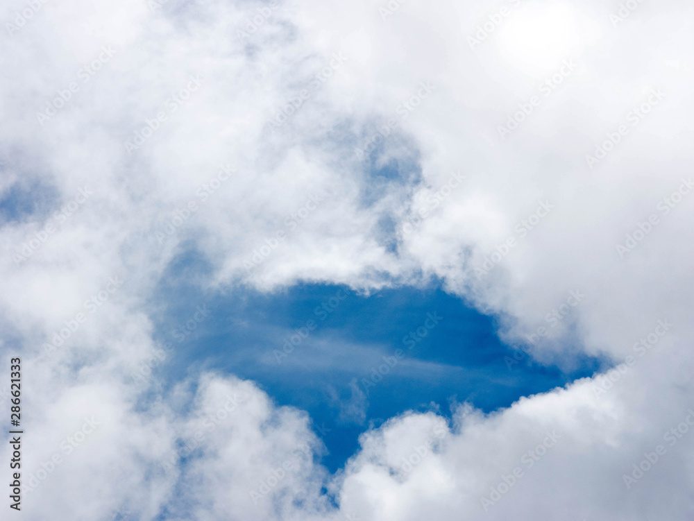 Obraz premium white clouds with the blue sky background.