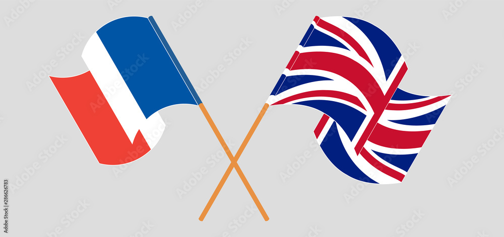 Crossed and waving flags of France and the UK