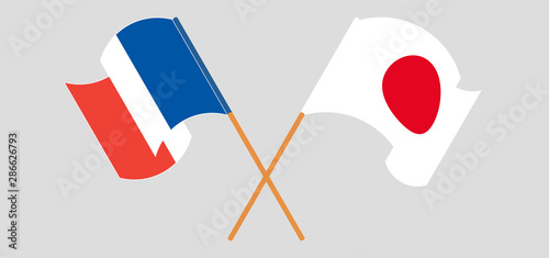 Crossed and waving flags of France and Japan