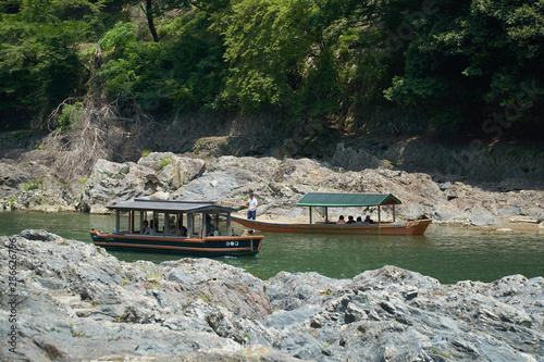 Katsura River,Kyoto,Japan - July 7,2019 : Tourists on the boats in the Katsura river