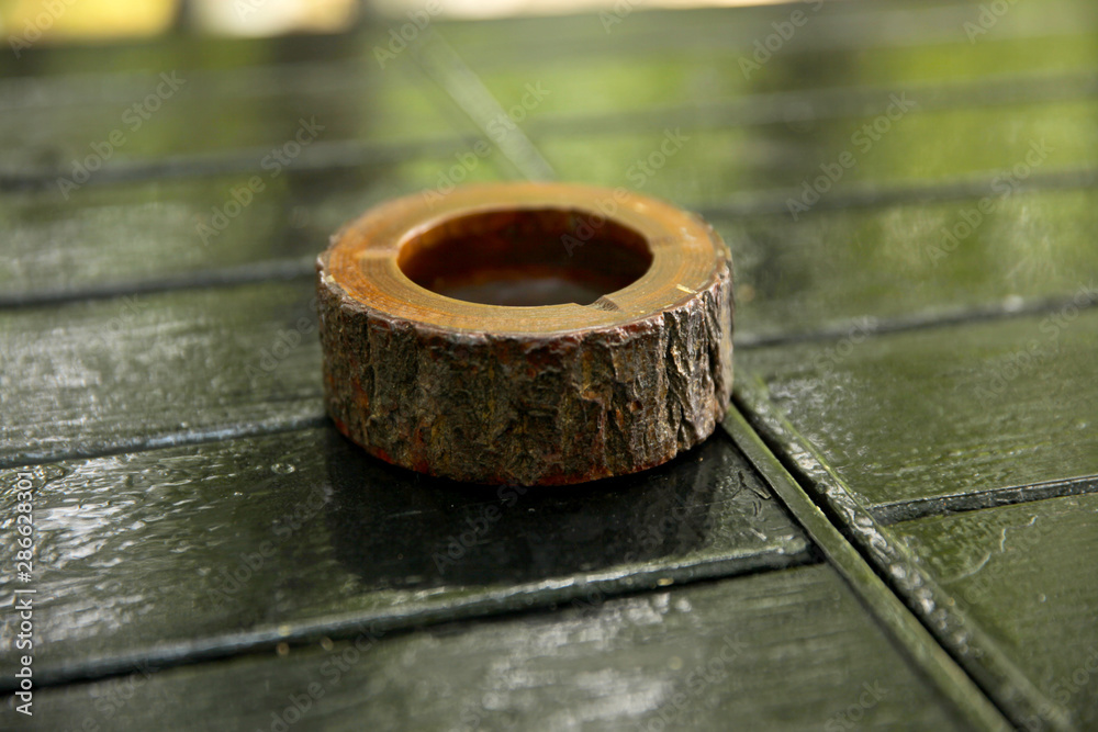Wooden ashtray on the wooden table Wooden ashtray on the wooden table