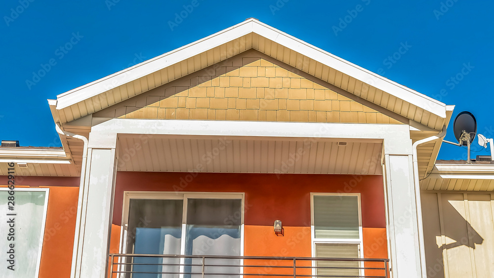 Panorama frame Close up of the balcony of a home with a combination of white and otange wall Panorama frame Close up of the balcony of a home with a combination of white and otange wall