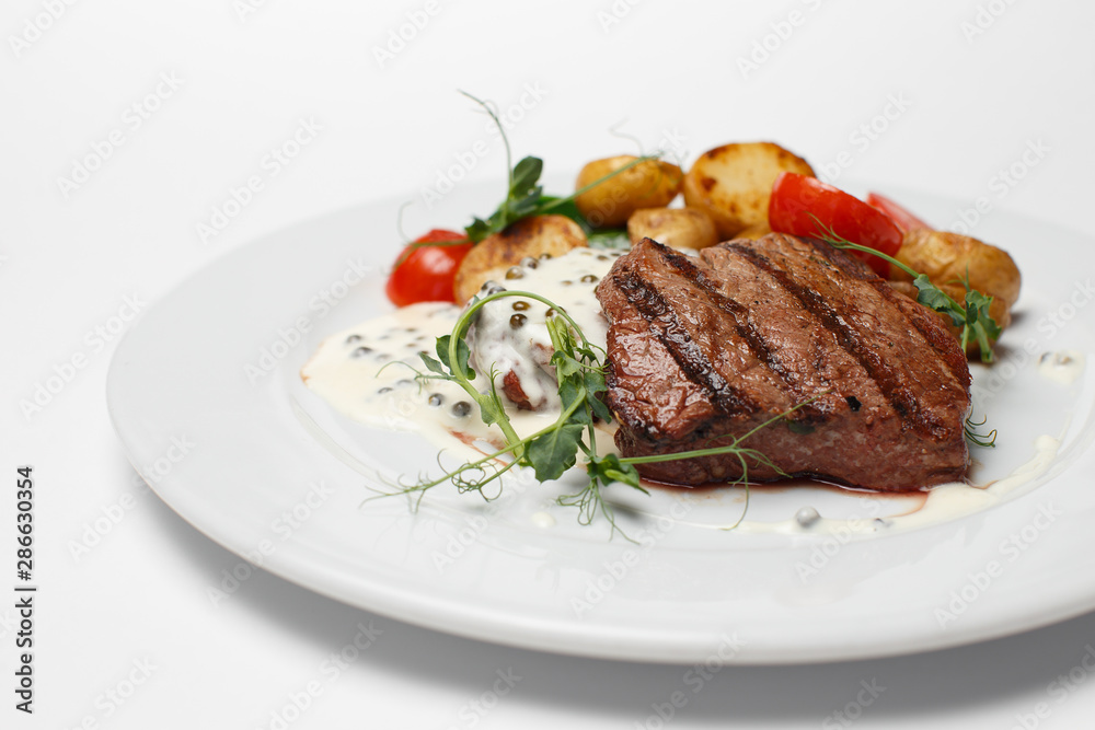 beef steak with baked potatoes and vegetables beef steak with baked potatoes and vegetables