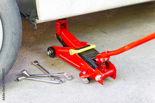 red tool jack lift car for Maintenance and service of cars at Car care maintenance