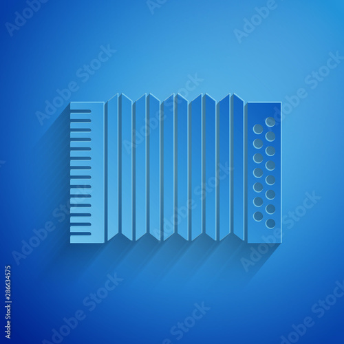 Paper cut Musical instrument accordion icon isolated on blue background. Classical bayan, harmonic. Paper art style. Vector Illustration