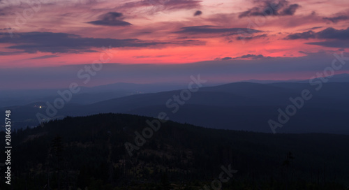 Sunset with distant hill from Tristolicnik. Blue hour. Sumava National Park and Bavarian Forest, Czech republic and Germany © Space Creator