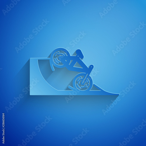 Paper cut Bicycle on street ramp icon isolated on blue background. Skate park. Extreme sport. Sport equipment. Paper art style. Vector Illustration