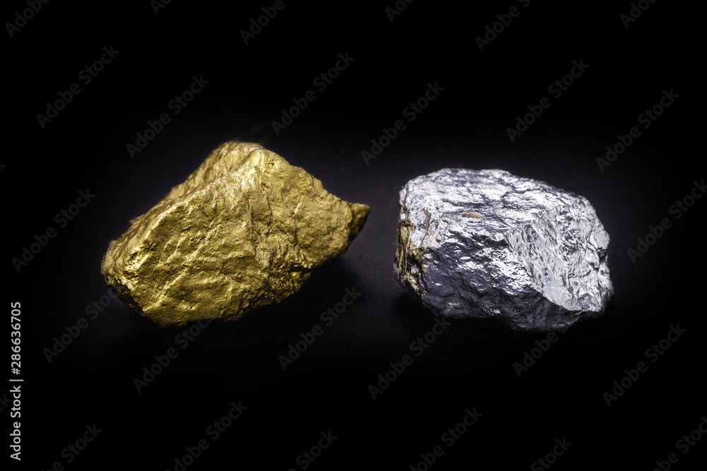 Gold and silver nuggets on black background. Precious stones, luxury concept and mineral drainage. Industrial activity, treasure and fortune.