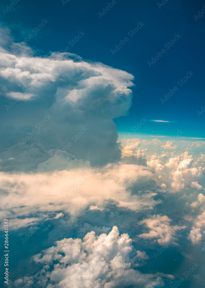 Naklejka premium The cloud landscape at an altitude of 10,000 meters under the sun
