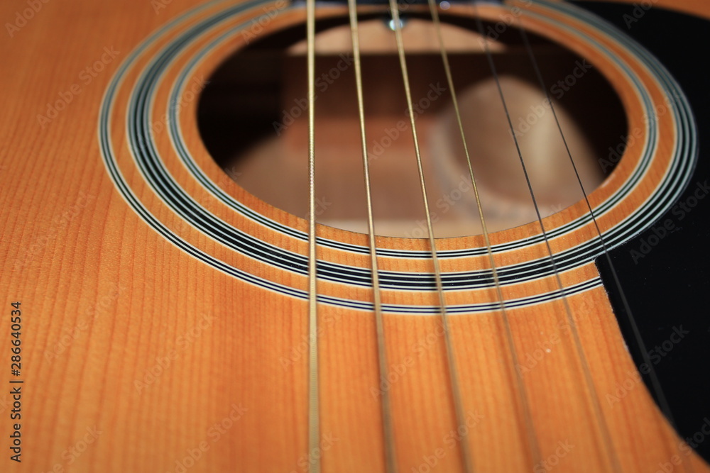 Obraz premium Acoustic six-string guitar close-up. Suitable for background.