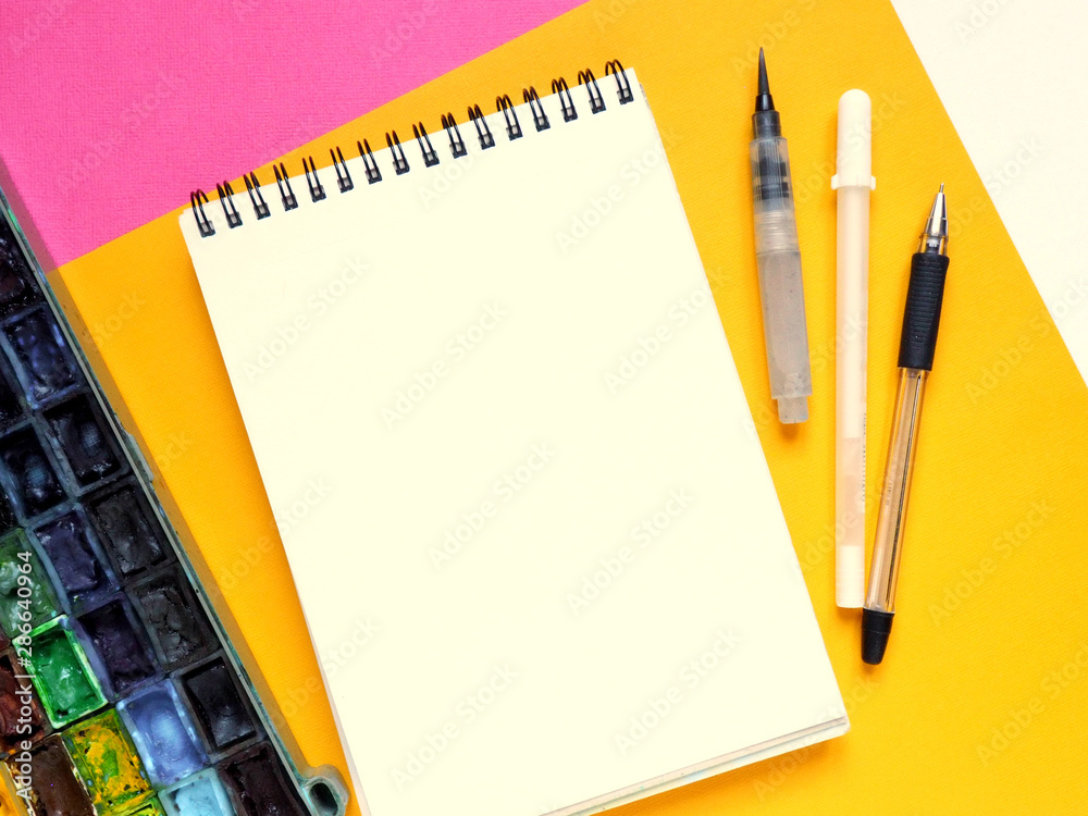 Template with blank notebook and drawing tools on white, yellow and pink paper background. Template with blank notebook and drawing tools on white, yellow and pink paper background.