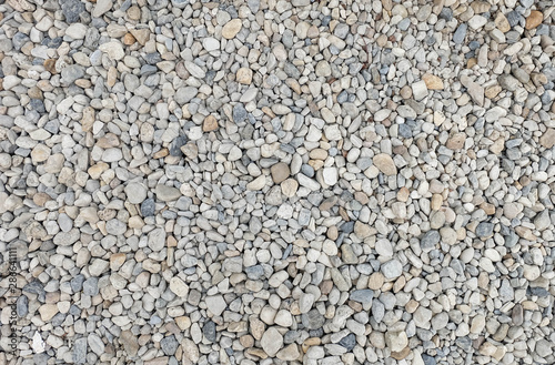 round stone pebbles texture, little stone material background pattern. 