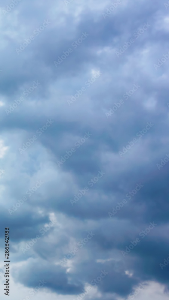 Vertical photograph of dark blue clouds before a thunderstorm