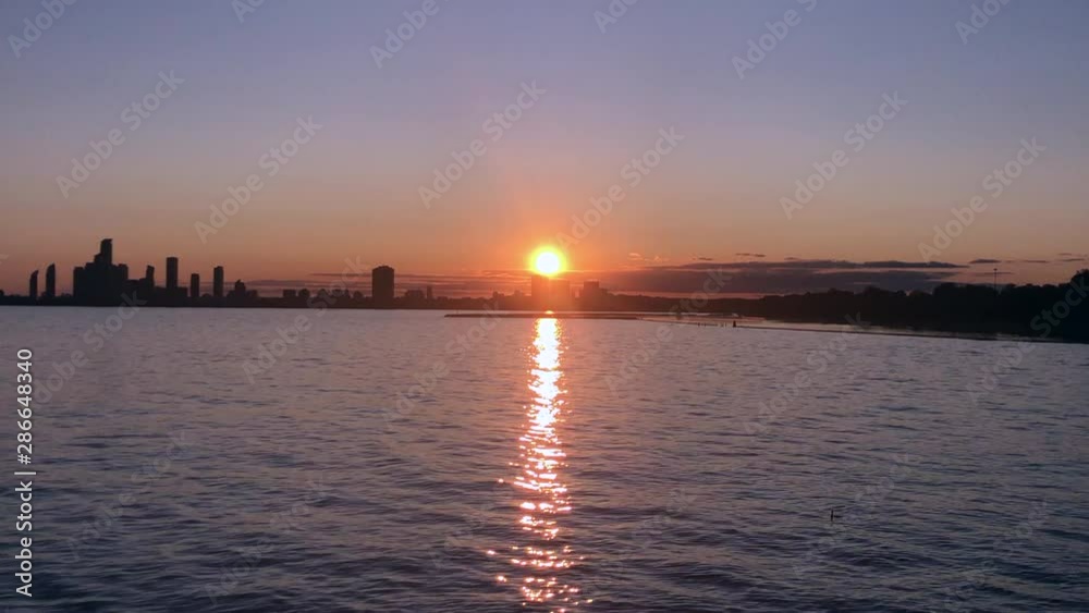 this is a video of the city on a lake at sunset this is a video of the city on a lake at sunset