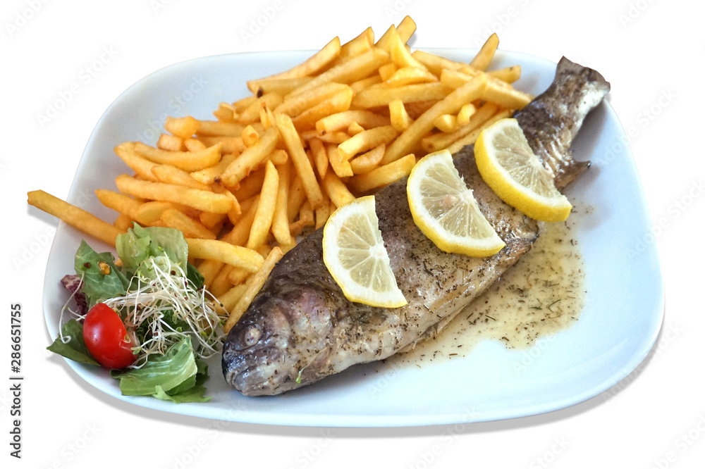 Baked fish - trout, salad and french fries on plate