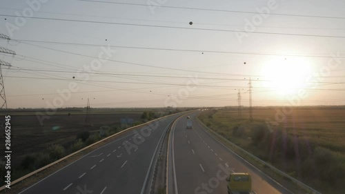 Cars rolling on a highway at sunset, timelapse photo