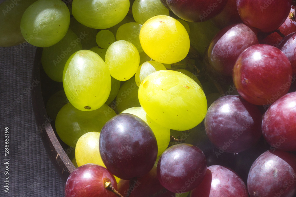 A bunch of ripe white and red table grapes 