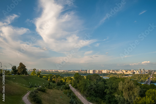 View of the city of Kiev  the Dnieper River. City panorama with a place across the river  park  summer day.