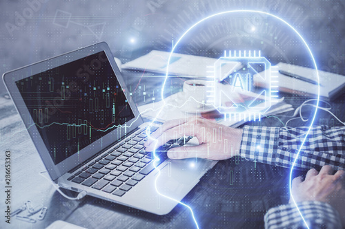 Man typing on keyboard background with brain hologram. Concept of big Data.