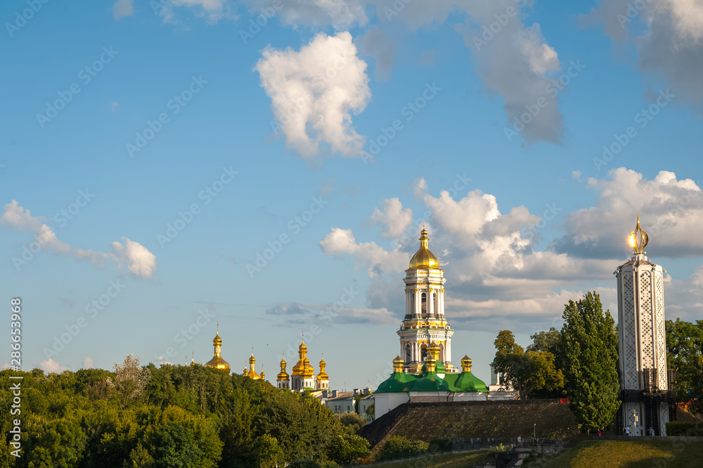 View of the city of Kiev, the Dnieper River. City panorama with a place across the river, park, summer day.