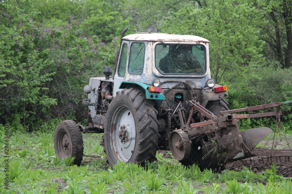 Fototapeta premium old tractor in the field